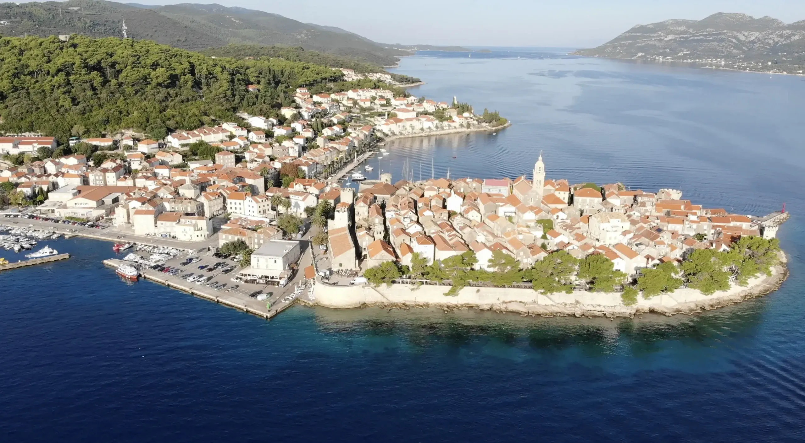 Korčula old town from the air, red roofs surrounded by sea